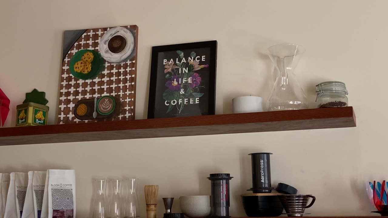 Shelf with coffee gear and art